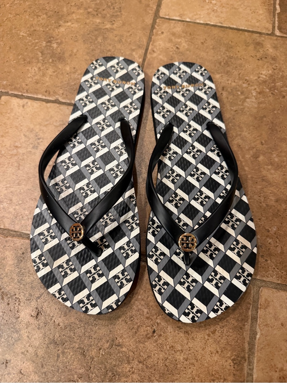 Tory Burch Black and White Geometric Logo Flip Flops with Gold Emblem